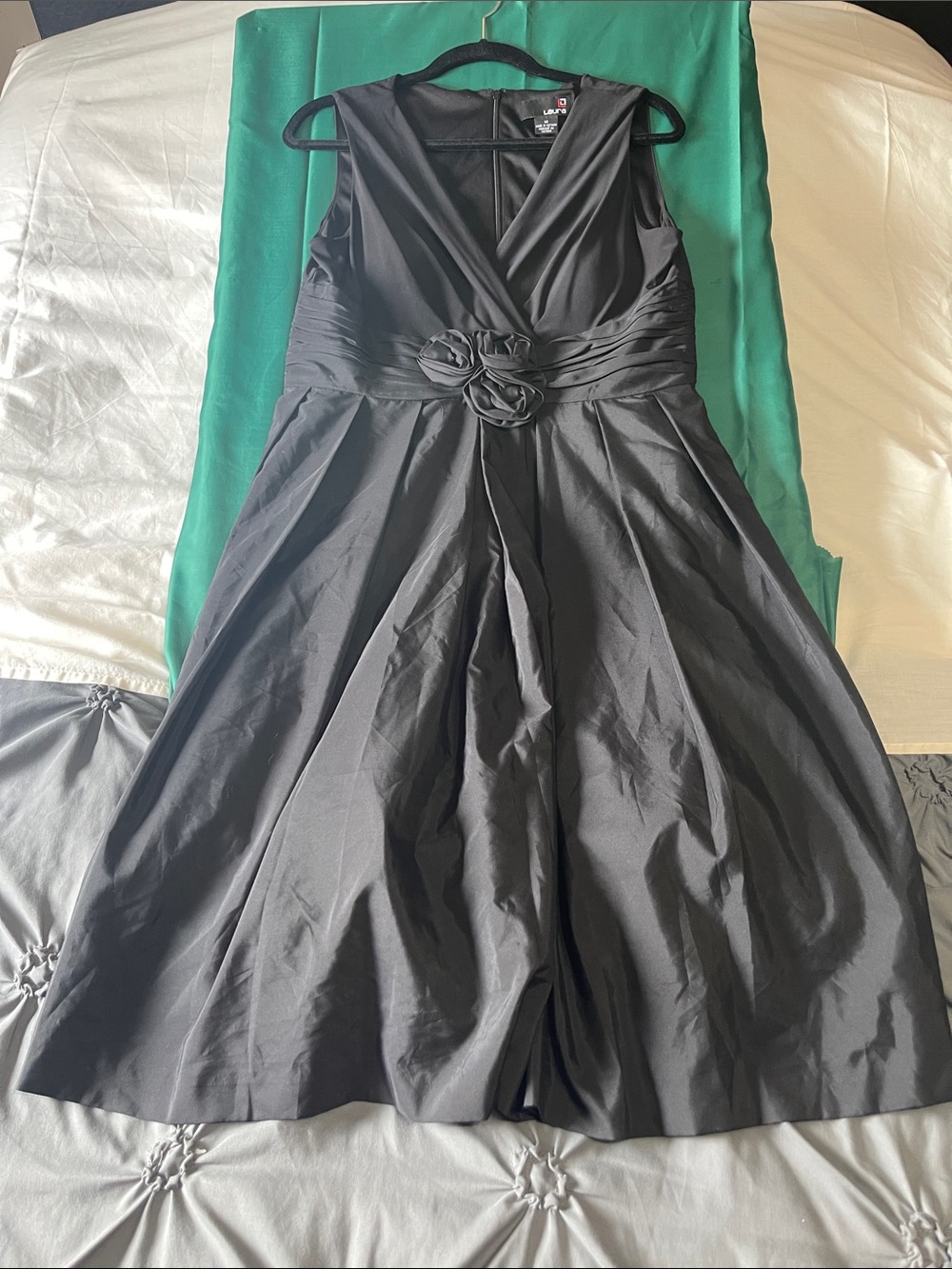 Sleeveless Black V-Neck Midi Dress with Floral Waist Detail